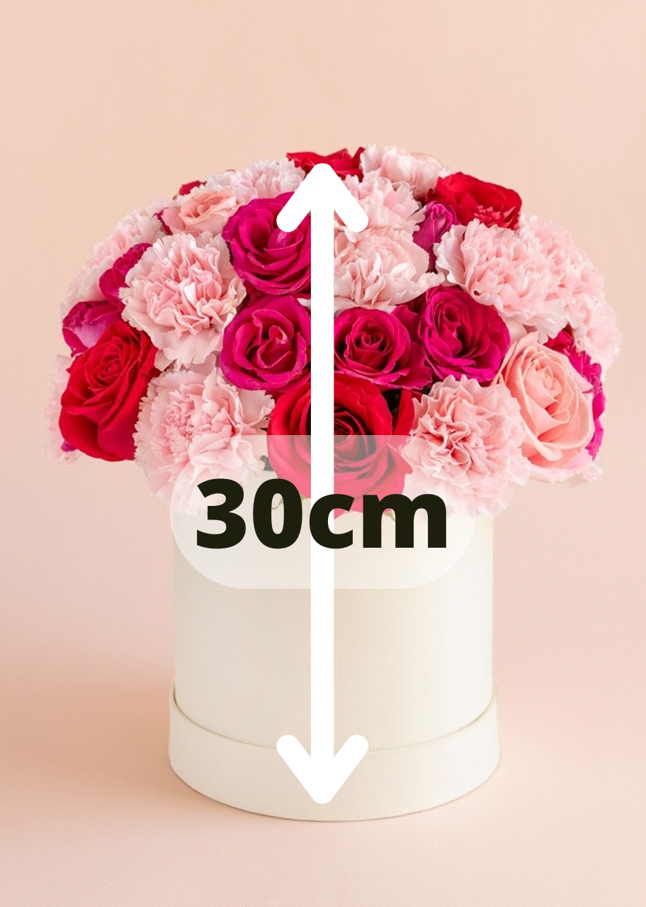 Caja con rosas rosas y rojas