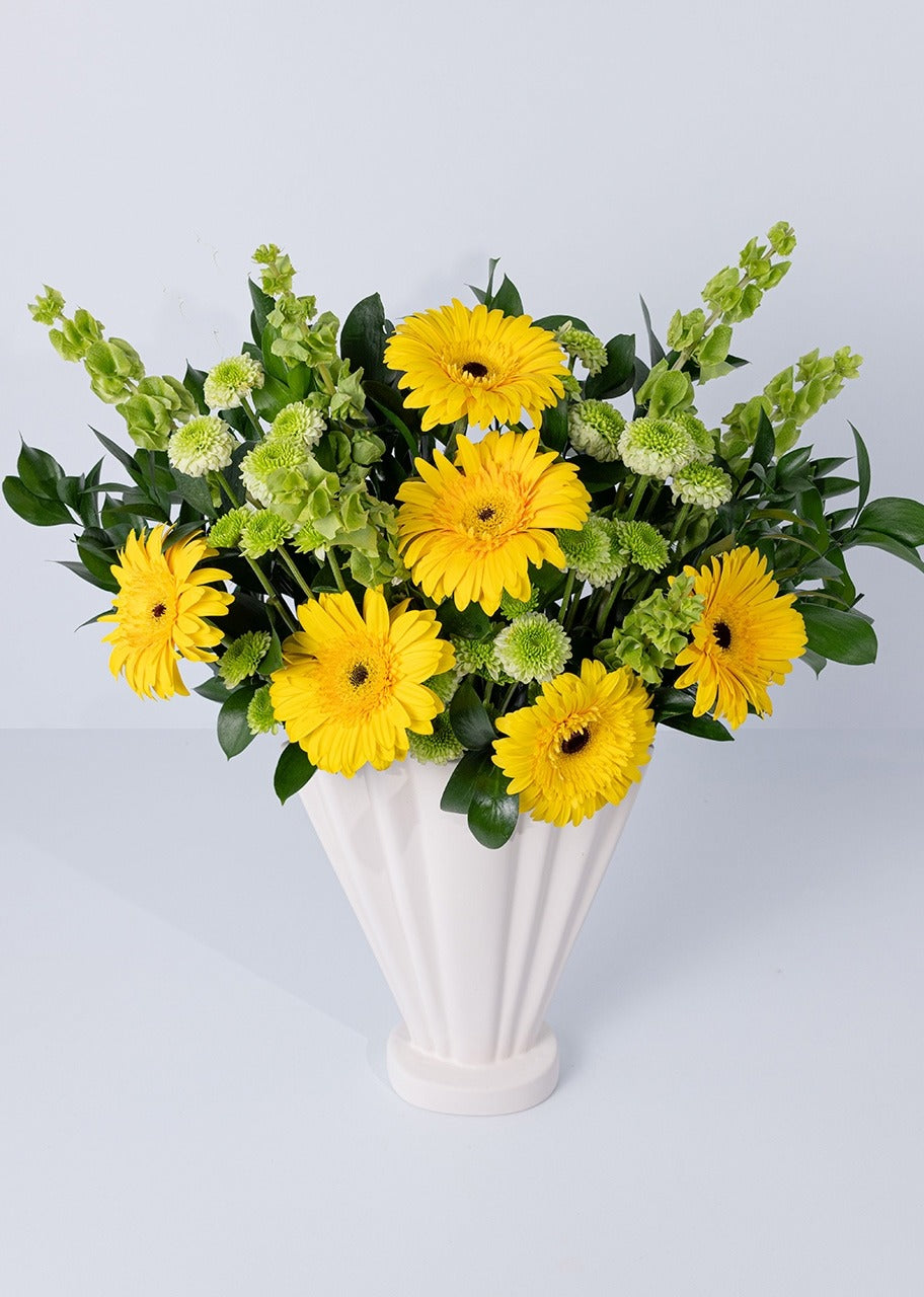 6 gerberas amarillas en jarrón